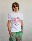 Model wearing a unisex black Boodja t-shirt styled in a relaxed, gender-neutral fit against a minimalist background.