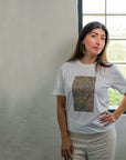 Detail view of the Indigenous Dry Country pattern printed on a Kirrikin unisex graphic tee.