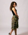Side view of model wearing the black Lauren Heart Top paired with the matching tiered ruffle skirt in Kimberley Grass and Leaves print.