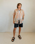 Kirrikin men's casual button-up short sleeve shirt with vibrant Australian Indigenous artwork by Sheryl Hicks.