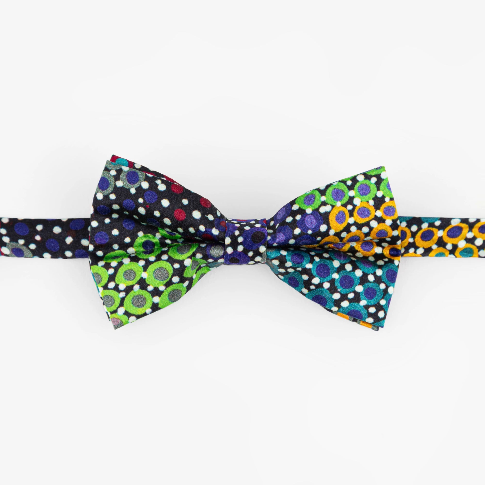 Close-up of the handcrafted Pilbara Wildflowers printed silk bow tie highlighting vibrant First Nations botanical art and fine silk texture.