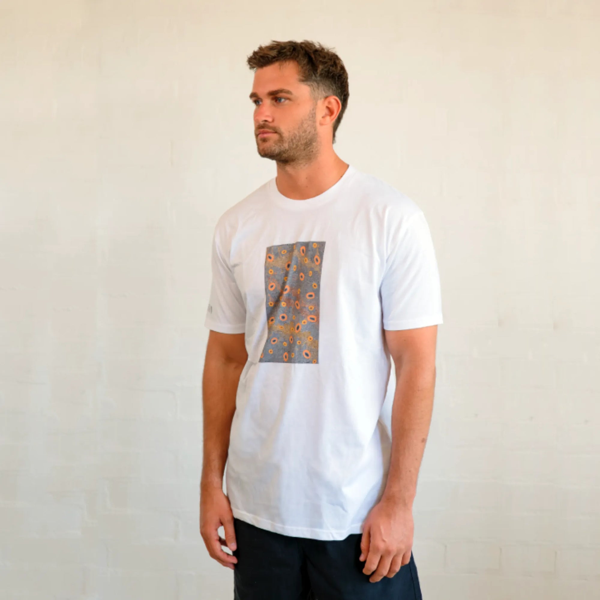 Unisex Dry Country t-shirt featuring authentic First Nations artwork by Kirrikin, printed on comfortable organic cotton.