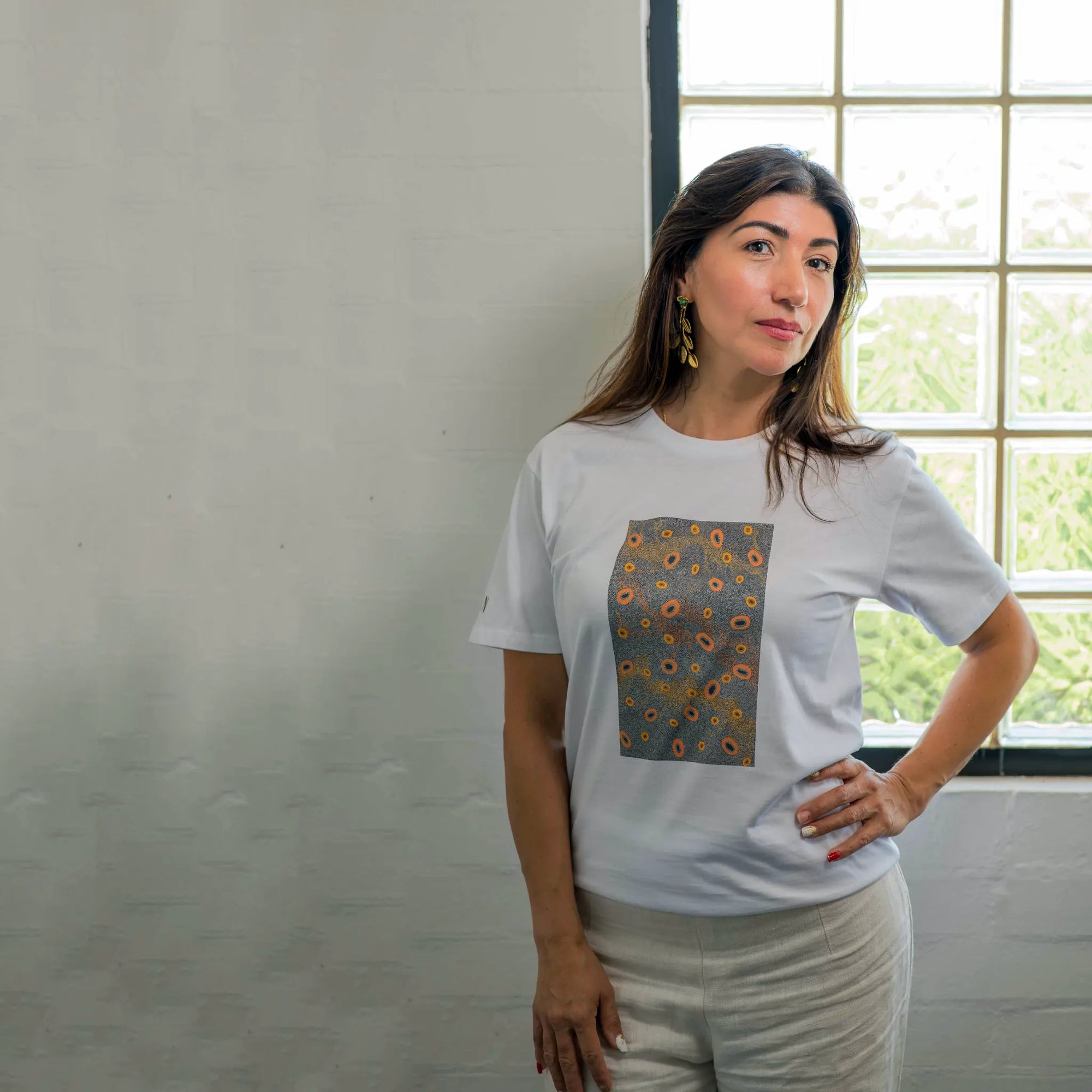 Detail view of the Indigenous Dry Country pattern printed on a Kirrikin unisex graphic tee.