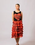 Front view of model wearing the black Lauren Heart Top featuring Overland Sigh heart applique by Emma Kerslake with a tiered ruffle skirt.