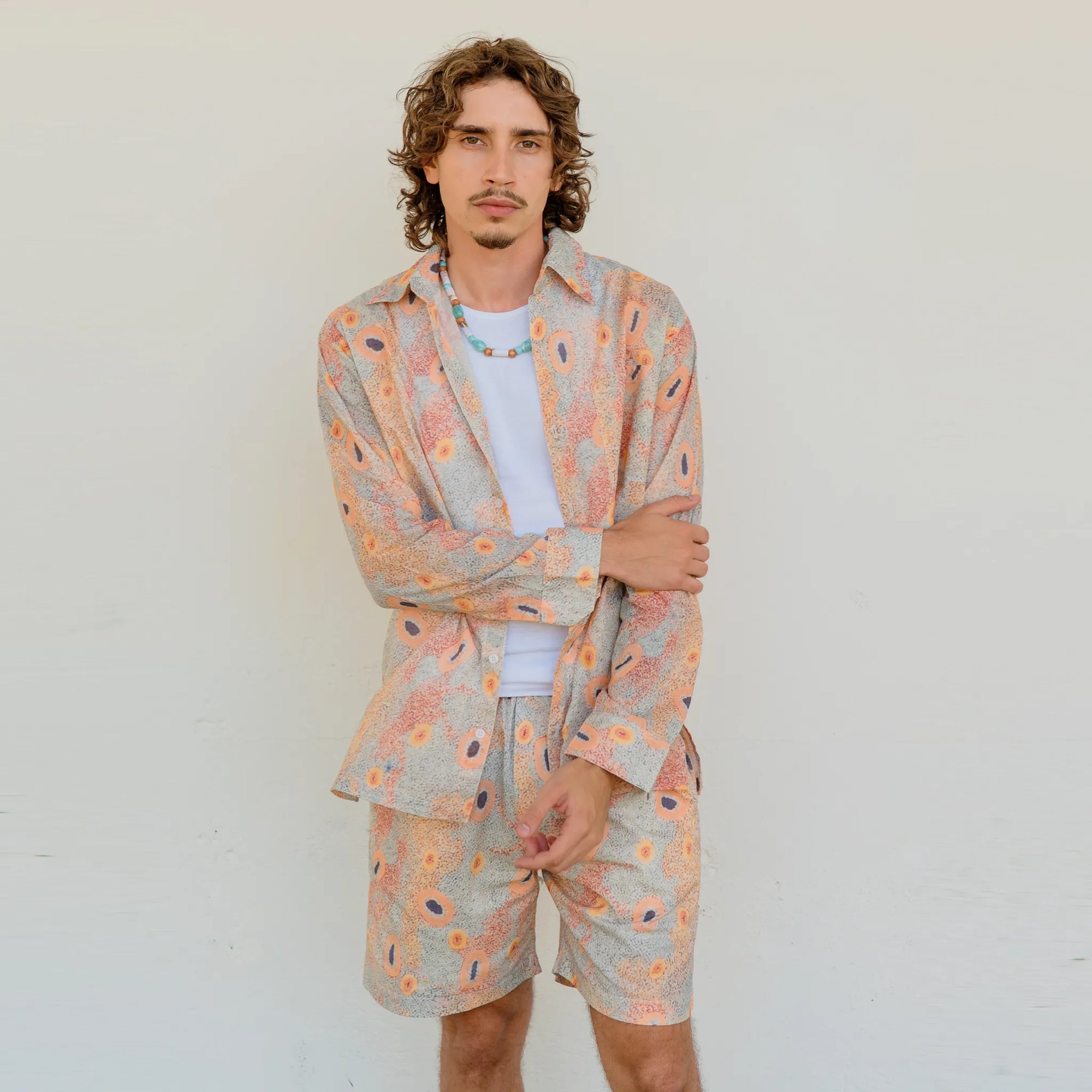 Kirrikin men's relaxed fit long sleeve button-up shirt with vibrant Australian Indigenous art print.