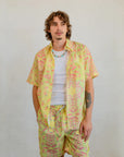Collar and button detail on the Kirrikin men's Honey Ants short sleeve shirt with Indigenous artwork.