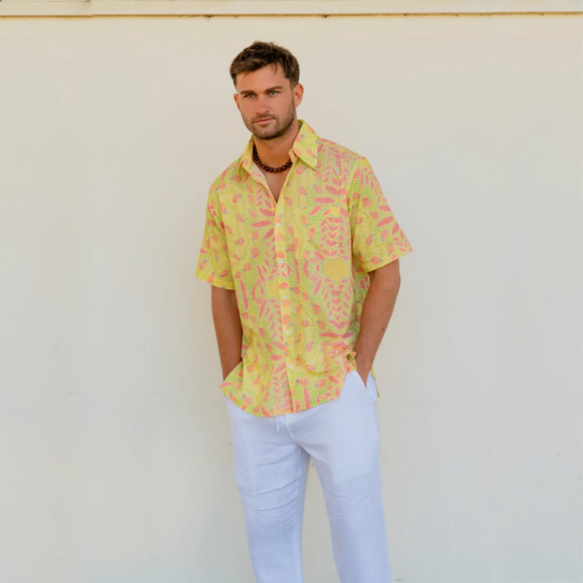Kirrikin men's casual short sleeve button-up shirt with vibrant Australian Indigenous Honey Ants art print.