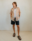 Breathable men's resort-style short sleeve shirt with original Aboriginal art pattern, designed by Kirrikin.