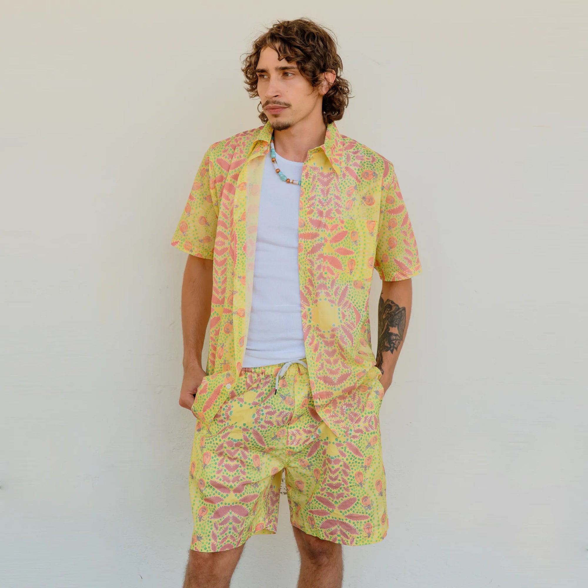 Kirrikin Men's Honey Ants casual board shorts with vibrant Australian Indigenous art print for summer wear.