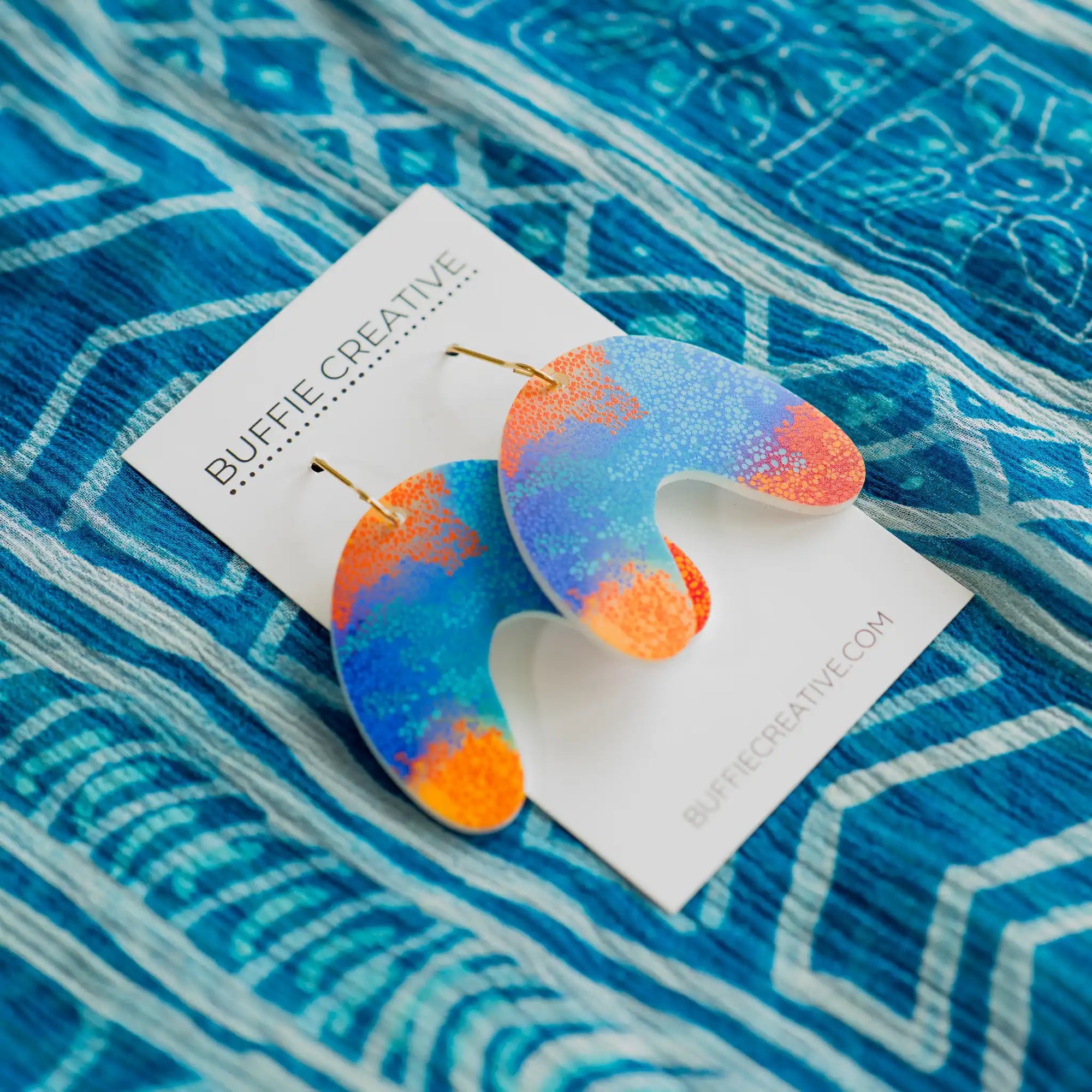 Contemporary U-shaped Makuru earrings by Buffie Punch, celebrating Australian First Nations art and culture.