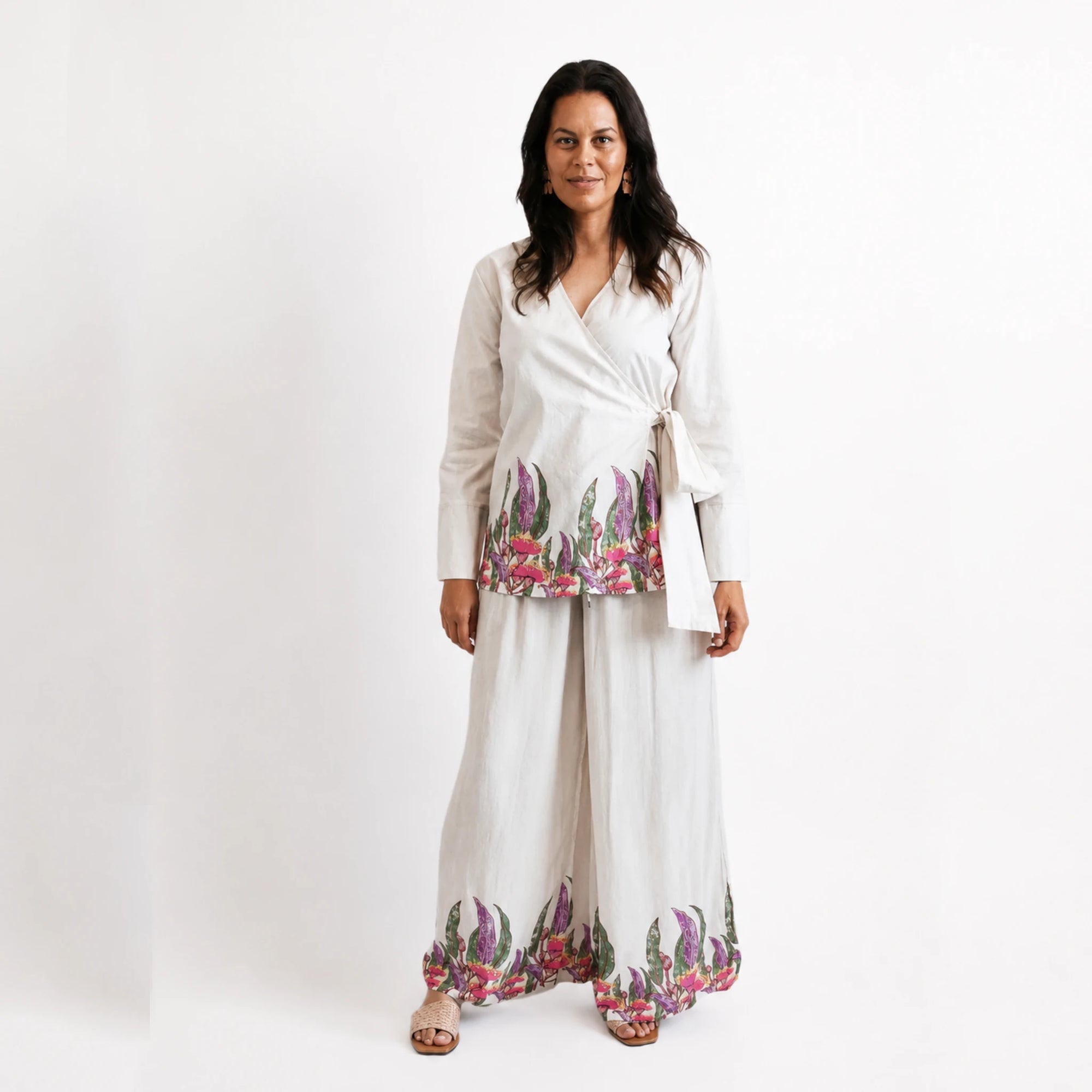 the Princess Gum wrap blouse highlighting intricate First Nations graphic artwork and delicate pink floral print details.